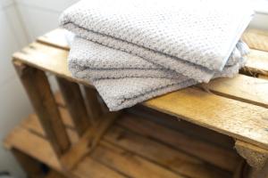a towel sitting on top of a wooden table at Zum Hecher Klausi in Wackersberg