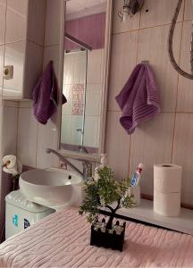 a bathroom with a sink and a toilet and a sink at Central Comfort Apartment 5 Minute Walk to Beach, Free Parking, 2 BR in Struga