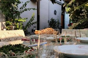 a table with plates and bowls of food on it at Arya Roof House in Marmaris