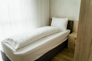 Postel nebo postele na pokoji v ubytování Lamede SELF CHECK-IN