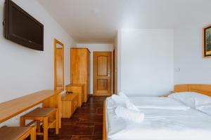 Posteľ alebo postele v izbe v ubytovaní Hotel Lukov Dom
