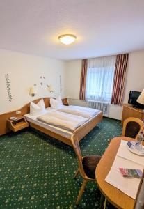 Postel nebo postele na pokoji v ubytování Hotel Fidelitas