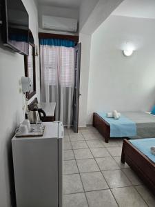 Ένα ή περισσότερα κρεβάτια σε δωμάτιο στο Hotel Leta 