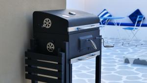 a black and silver appliance sitting on a wall at Palms Residence Inn دار النخيل in Nizwa