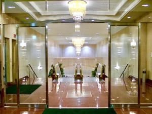 a room with a display case in a building at Yonago Universal Hotel in Yonago