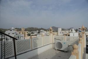 a balcony with a view of a city at Gulmohar Homes in Udaipur