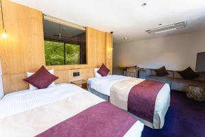 Vuode tai vuoteita majoituspaikassa KAMENOI HOTEL Nikko Yunishigawa All-Inclusive Resort
