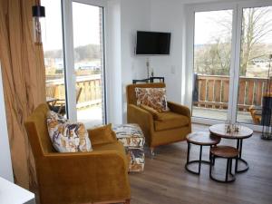 Μια τηλεόραση ή/και κέντρο ψυχαγωγίας στο Holiday apartment pure lake view