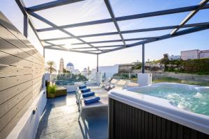 a hot tub on the roof of a house at Marillia's elegance residence in Mesaria