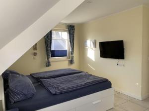 A bed or beds in a room at Holiday home Miami