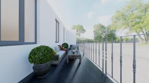 een woonkamer met een bank op een balkon bij BW5 - Luxurious three bedroom apartment - 110qm - AC in Mülheim an der Ruhr