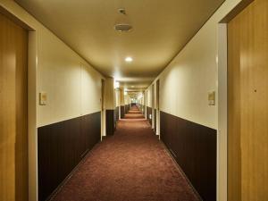 a hallway of an office building with a long corridor at Kansai Airport Washington Hotel in Izumi-Sano