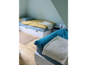 a bedroom with two twin beds at Holiday home Kate keit in Altenhof