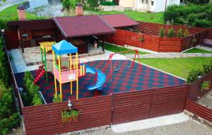 an aerial view of a backyard with a playground at Vila Moldavia Class in Slănic-Moldova