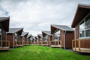 a row of houses with grass in front of them at Tromsø Lodge & Camping in Tromsø