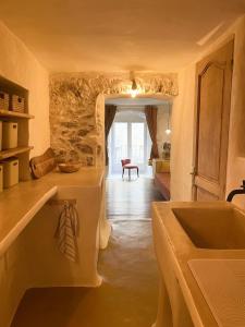 a kitchen with a sink and a counter top at Felicità : appartement atypique centre Bastia in Bastia