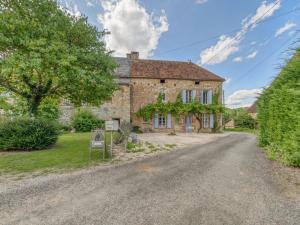 an old stone house with a road in front of it at Alluring Holiday Home in D gagnac with Heated Pool in Dégagnac