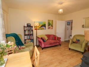 a living room with two chairs and a couch at Bousdale Cottage in Guisborough