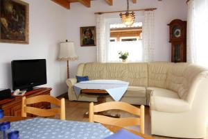 a living room with a couch and a table at Holiday village on the Baltic Sea Wohlenberg in Wohlenberg