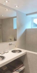 a bathroom with two sinks and a large mirror at Casa dolce Casa apartment Oslo in Oslo