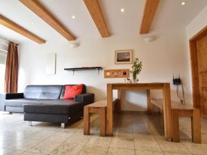 a living room with a couch and a table at Holiday home with beautiful view on the village in Varsberg