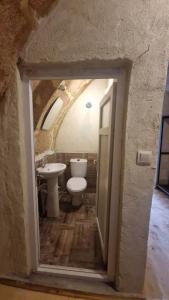 a bathroom with a toilet and a sink at KING SOLOMON PALACE in Avanos
