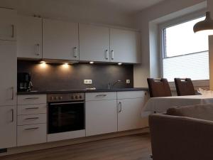 Η κουζίνα ή μικρή κουζίνα στο Holiday apartment Bathmann