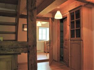 a room with a hallway with a door and a window at Chic Apartment in Thuringia with Sauna in Hamma