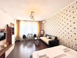 TV a/nebo společenská místnost v ubytování Mercur Home + 10 fotografií