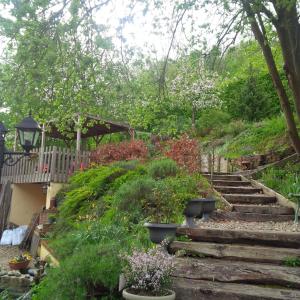 a set of stairs in a garden with plants at DUCK HOUSE in Saint-Wandrille-Rançon