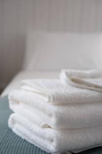 a stack of white towels sitting on a table at Starry Night Farmstay in Forbes