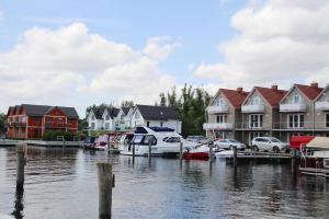 a group of houses and boats in a marina at Apartment Hafenflair am Plauer See Plau am See in Plau am See