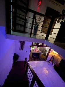 an overhead view of a room with purple lighting at Jumelle Residence in Horetuduwa