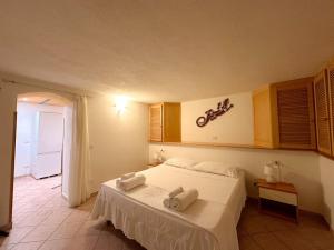 Postel nebo postele na pokoji v ubytování OLBIA [vicino al centro]