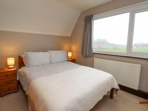 Giường trong phòng chung tại Whitestacks