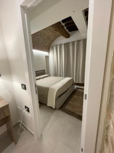 Ένα ή περισσότερα κρεβάτια σε δωμάτιο στο La Locanda sulla Francigena