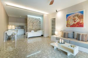 a living room with a couch and a table at Nereids Apartments in Sitia