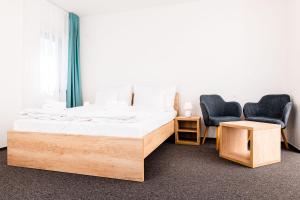 A bed or beds in a room at Apartmanovy dom Familia Smokovec