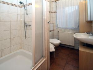 a bathroom with a shower and a sink and a toilet at Apartments Spreewaldperle Alt Zauche in Alt Zauche