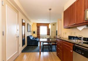 a kitchen with a table and a dining room at Beautiful & Cozy 1BR in NYC! in New York
