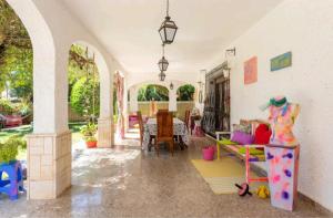 a living room with a couch and a table at Chez Moi Orange Room in El Campello