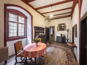 a living room with a table and chairs and a window at Lovely apartment in Unsleben in Unsleben