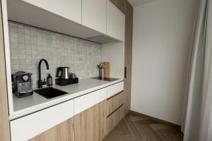 a kitchen with a sink and a counter top at Hotel Restaurant De Zwaan in Raalte
