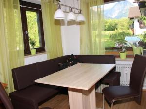 a dining room with a table and two chairs at Holiday apartment Rosi Denz in Bad Au