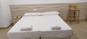 Posteľ alebo postele v izbe v ubytovaní SM Apartments
