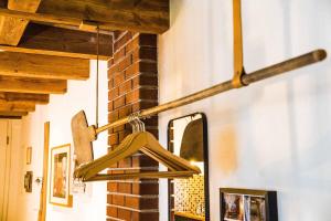 a wooden hanger hanging from a wall in a room at Besighomes Apartment Tiny House in Besigheim