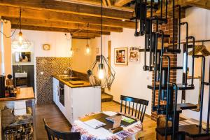 a room with a table and a kitchen with a table and chairs at Besighomes Apartment Tiny House in Besigheim