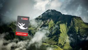 a mountain with a sign in front of it at THOMSN-Alpine Rock Hotel in Saalbach-Hinterglemm