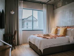 Postel nebo postele na pokoji v ubytování Hotel Mokozoyo