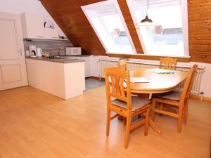 a kitchen and dining room with a table and chairs at Apartment in Westerland in Westerland